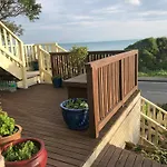 Seafront Haven In Island Bay With Deck, Outdoor Bath, And Parking