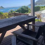 Seafront Haven In Island Bay With Deck, Outdoor Bath, And Parking